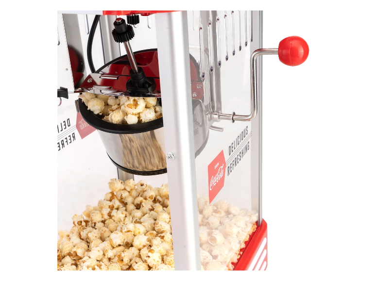 Popcornmachine met rode slinger en kant-en-klare popcorn, met de tekst 'DELICIOUS REFRESHING'.