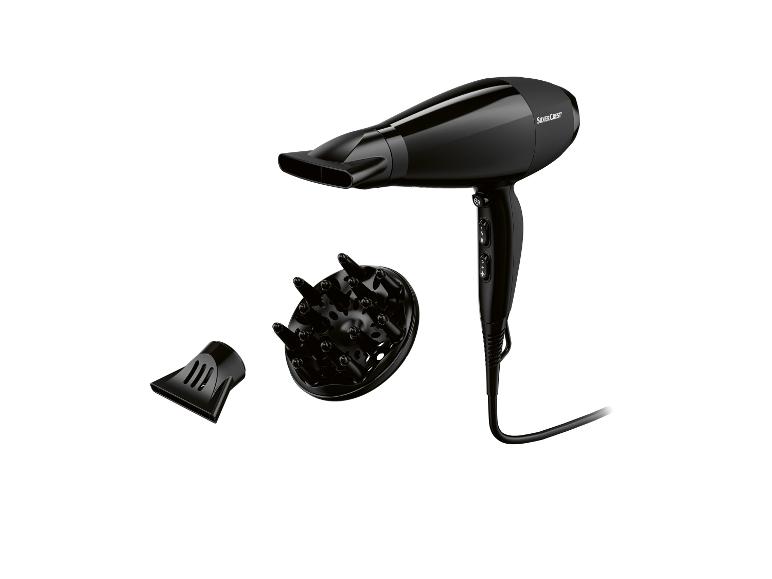 Zwarte SilverCrest haardroger met concentrator en diffuser.