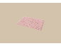 Roze badmat met golvend patroon op een beige achtergrond.