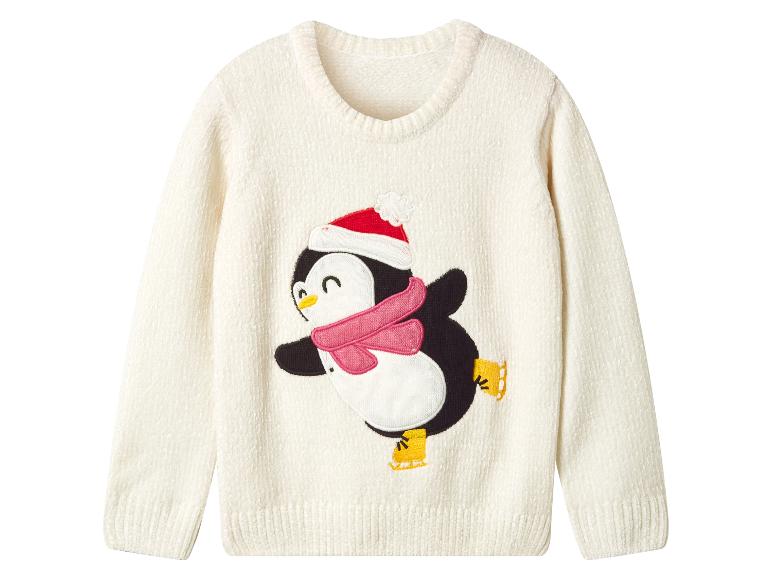 Witte trui met een schaatsende pinguïn, met een kerstmuts en een roze sjaal