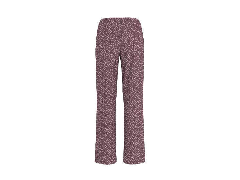 Lange broek met een wit bloemenpatroon op een bruine achtergrond