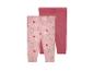 Twee baby leggings: één met roze bloemenprint en één effen roze.
