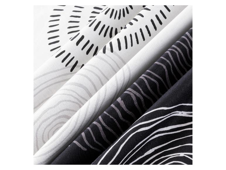 Stoffen met zwart-witte strepen en ronde patronen.