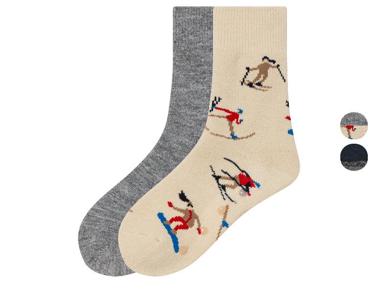 Grijze en crème sokken met ski-print.