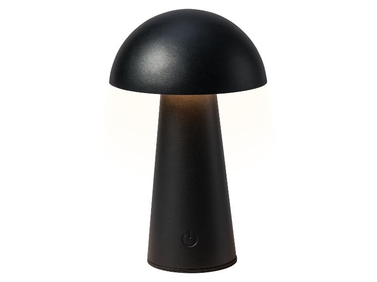 Zwarte paddestoelvormige tafellamp met aanraakknop, die warm licht uitstraalt.