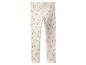 Witte kinderlegging met roze regenbogen en hartjes.