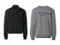 Zwart jack met rits en grijs sweatshirt met de tekst 