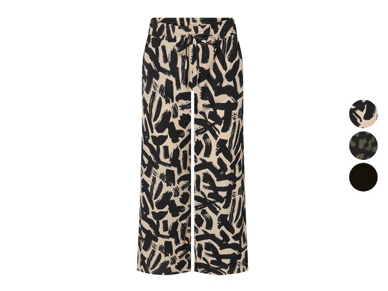 Wijde broek met abstracte print in beige en zwart.