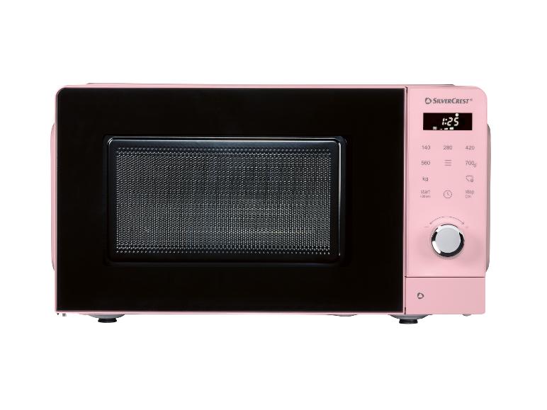 Roze magnetron met een zwarte deur en een digitaal bedieningspaneel.