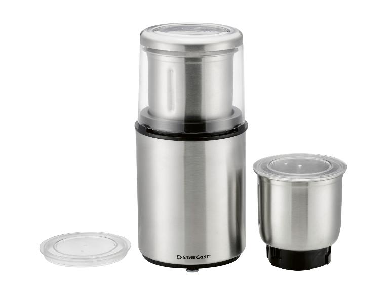 Roestvrijstalen koffie- en kruidenmolen met twee containers en transparante deksels.