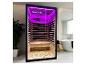 Infraroodsauna met paarse LED-verlichting in een moderne badkamer.