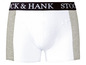 Witte onderbroek met grijze accenten en het merk 'Dock & Hank'.