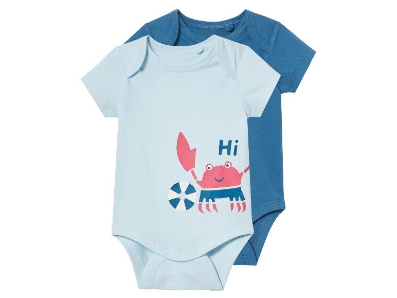 Baby rompertjes: lichtblauw met krabprint, effen donkerblauw.