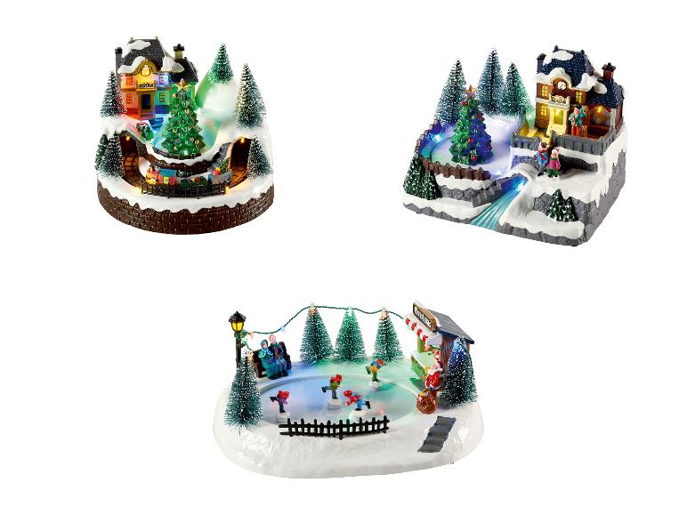 Drie verlichte kerstdorpscènes met een trein, ijsbaan en station.