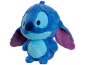 Blauwe pluche alienfiguur met grote ogen en paarse oren.