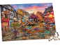 Een kleurrijke legpuzzel met een afbeelding van een schilderachtig stadje aan een kanaal bij zonsondergang.