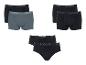 Drie sets herenondergoed: twee boxershorts sets (zwart en grijs, en volledig zwart) en één zwarte slip set.