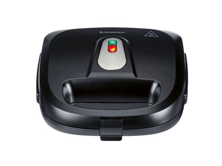 Zwart wafelijzer met indicatielampjes en handvat, bovenaanzicht.