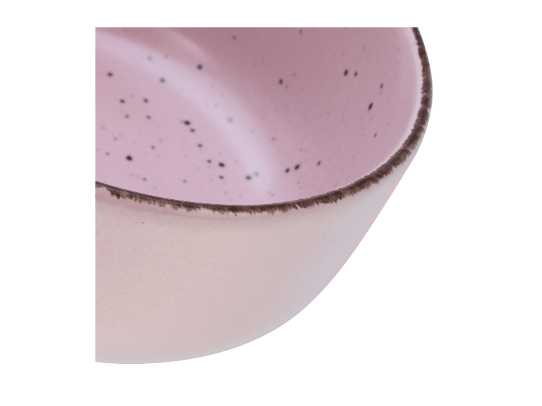 Lichtroze kom met donkere stippen, bruine rand.