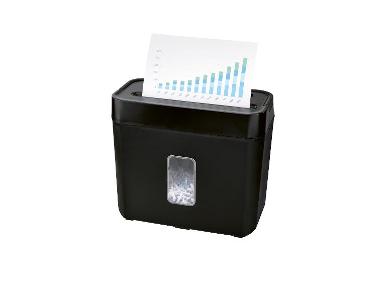 Zwarte papierversnipperaar met een vel met een grafiek dat erin wordt gevoerd.