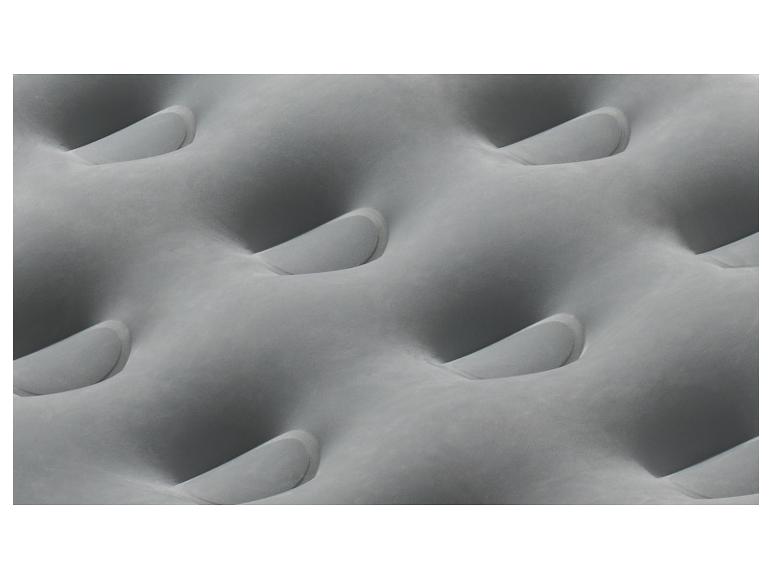 Grijs opblaasbaar matras met een golvend patroon.