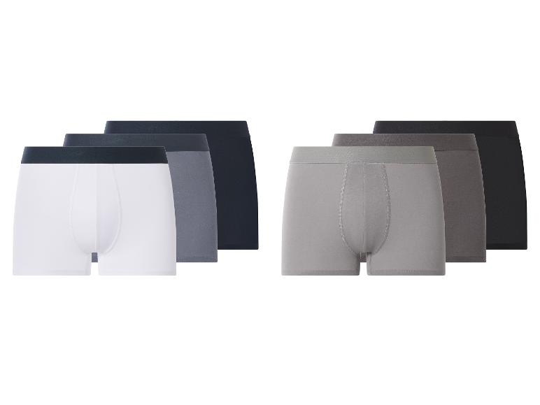 Set van zes herenboxershorts in wit, grijs en zwart.