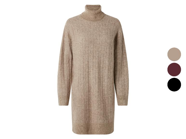 Beige kabelgebreide coltrui jurk met kleurkeuzes.