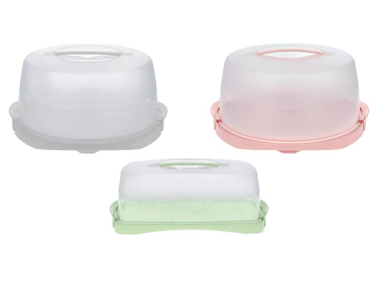 Set van drie plastic taart- en gebaksdozen in wit, roze en groen.