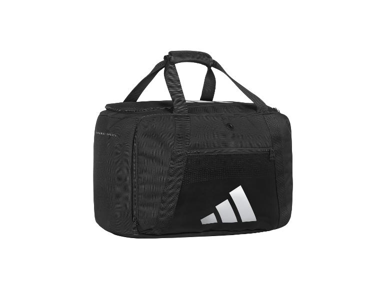 Zwarte sporttas met handvatten, ritsen en een wit logo, met de tekst 'COMBAT SPORTS'.
