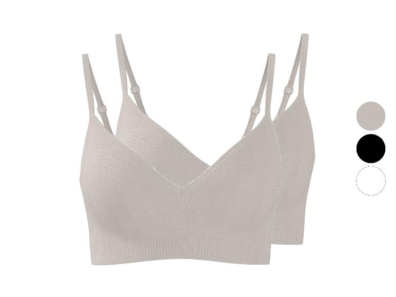 Twee beige geribbelde bralettes met verstelbare bandjes, met kleurstalen.