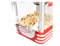 Popcornmachine met verse popcorn, in een retro rood-wit design.
