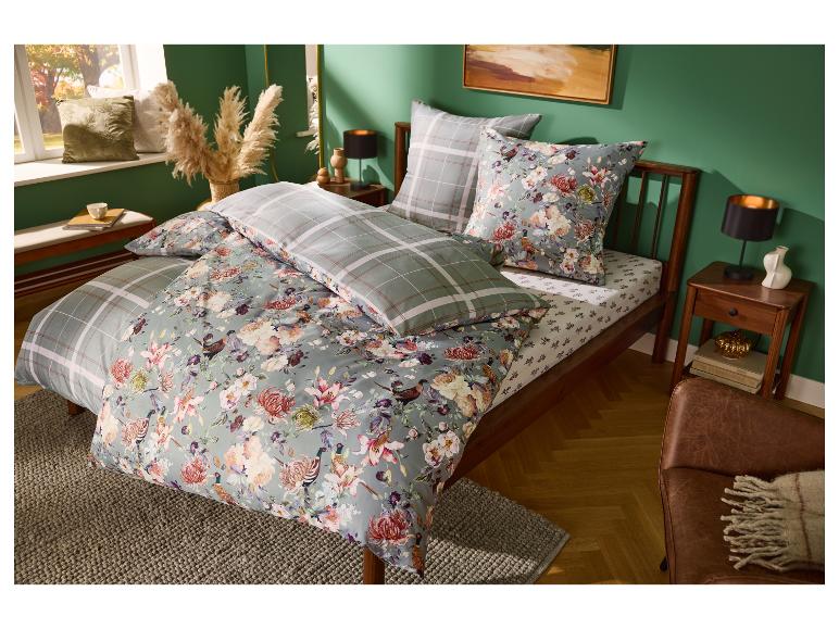 LIVARNO® jersey hoeslaken op een stijlvol opgemaakt bed.