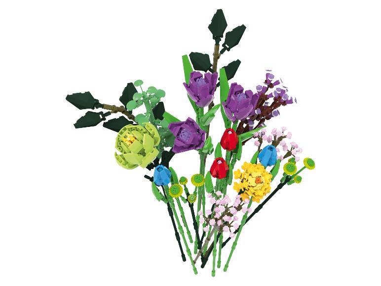Boeket van kleurrijke bloemen gebouwd van speelgoedstenen.