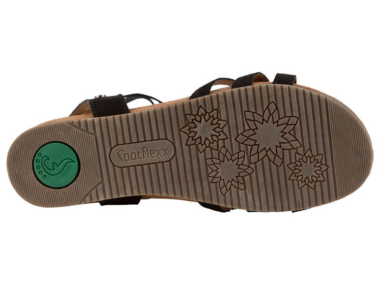 Zwarte sandalen van FootFlexx met een patroon van bloemen op de zool.