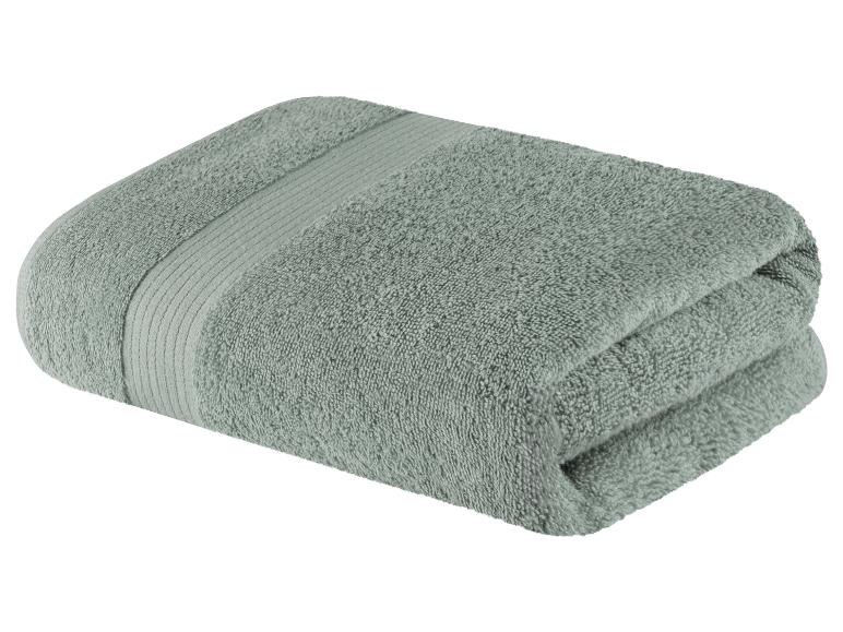 Opgevouwen badhanddoek, grijsgroene kleur.