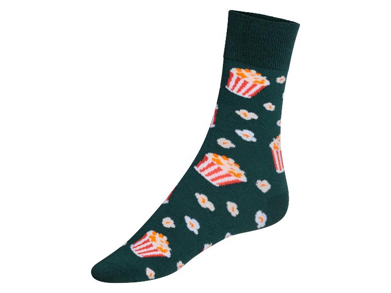 Een groene sok met popcornmotief.