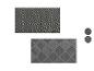 Twee tapijten met geometrische patronen in grijs en zwart.