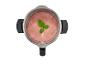 Bovenaanzicht van een blender met een roze smoothie en muntgarnering.