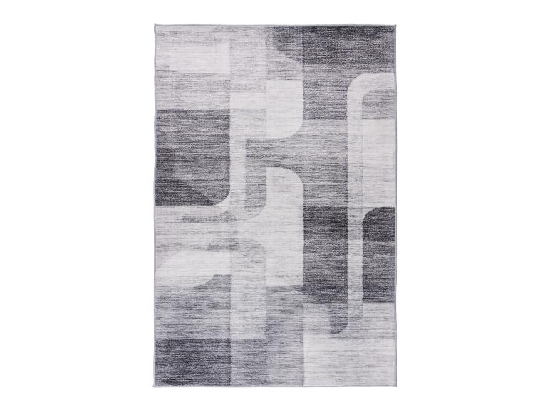 Modern grijs en wit vloerkleed met abstract geometrisch patroon.