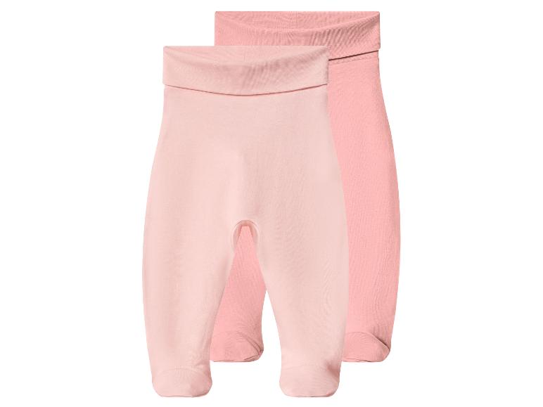 Twee roze babybroekjes met geïntegreerde voetjes en een omvouwbare tailleband.