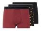 Drie boxershorts: één effen rode, twee met taco-print.