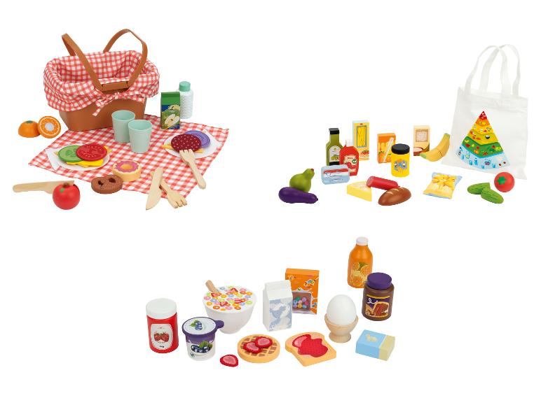 Speelgoedvoedselsets: picknickmand met eten, boodschappentas met items en ontbijt.