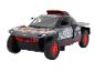 Een zwart Audi e-tron rallyauto model met rode velgen.
