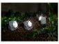 Drie decoratieve solar lampen in steen-design voor de tuin.