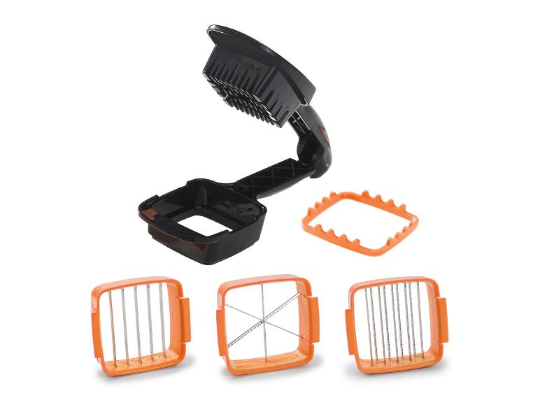 Zwarte groentesnijder met drie verwisselbare oranje messen en een frame.