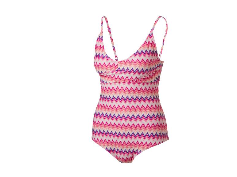 Dames badpak uit één stuk met roze en paars zigzagpatroon.
