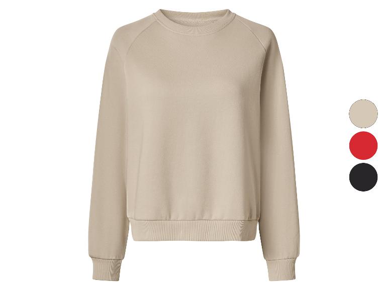 Beige sweatshirt met ronde hals en geribde boorden, getoond met kleuropties in beige, rood en zwart.
