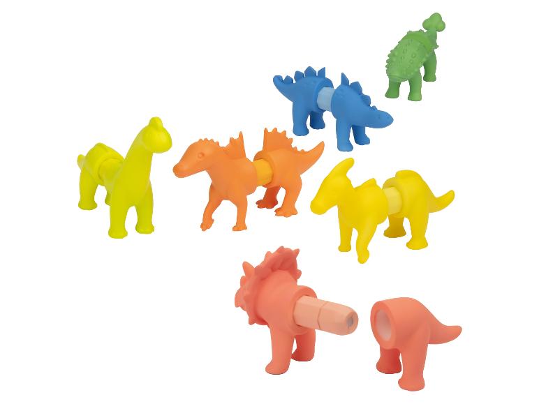 Kleurrijke, assembleerbare speelgoeddinosaurussen in gele, oranje, blauwe en groene tinten.