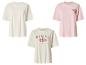 Drie dames T-shirts: wit, roze met 'Beach Resort' en crème met 'Hawaii Aloha'.