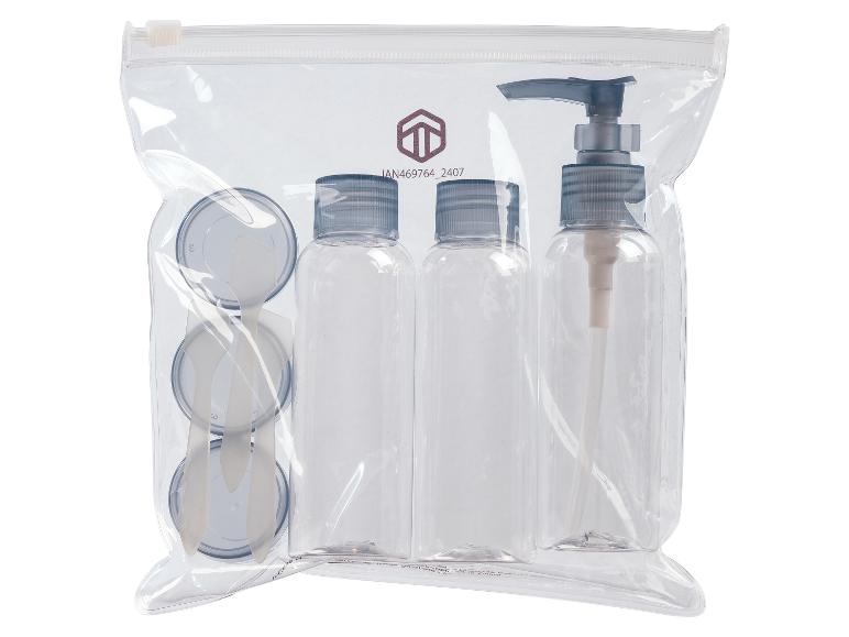 Reisset: flesjes, pompflacon en potjes met spatels.